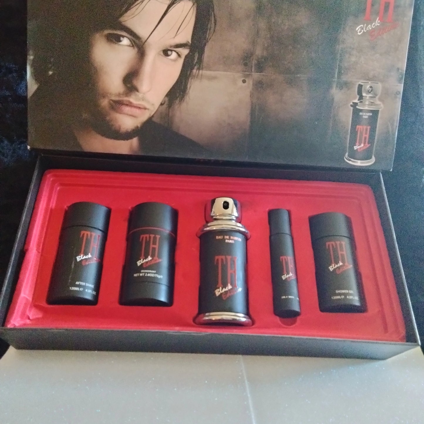 long lasting TH black edition cologne deodorant aftershave and shower gel.