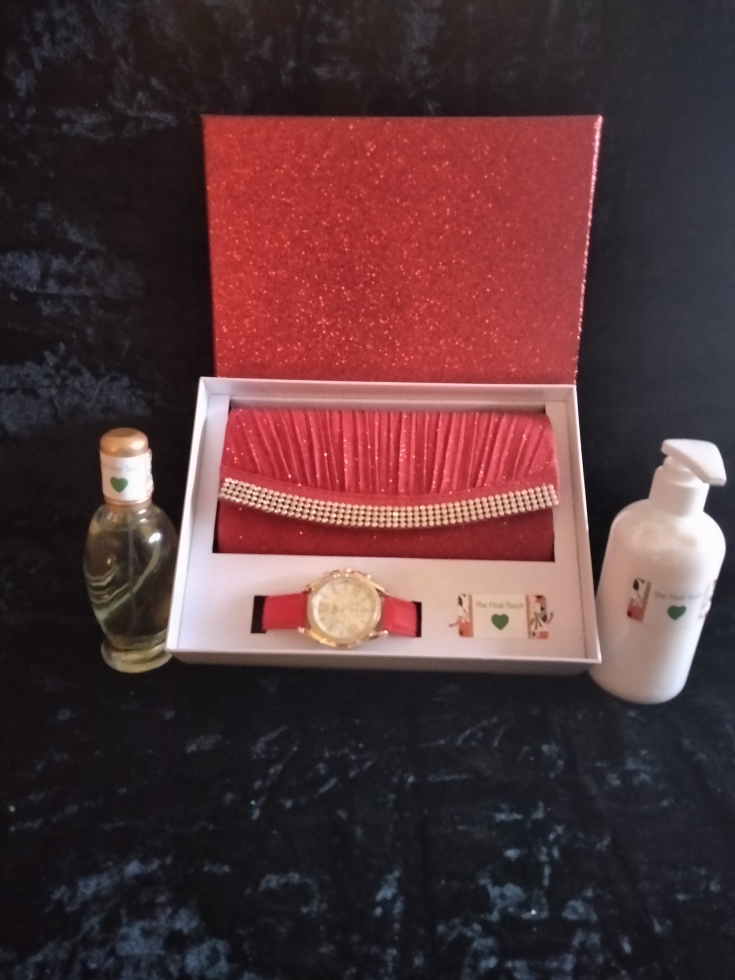 Purse matching watch perfume and skin care cream.