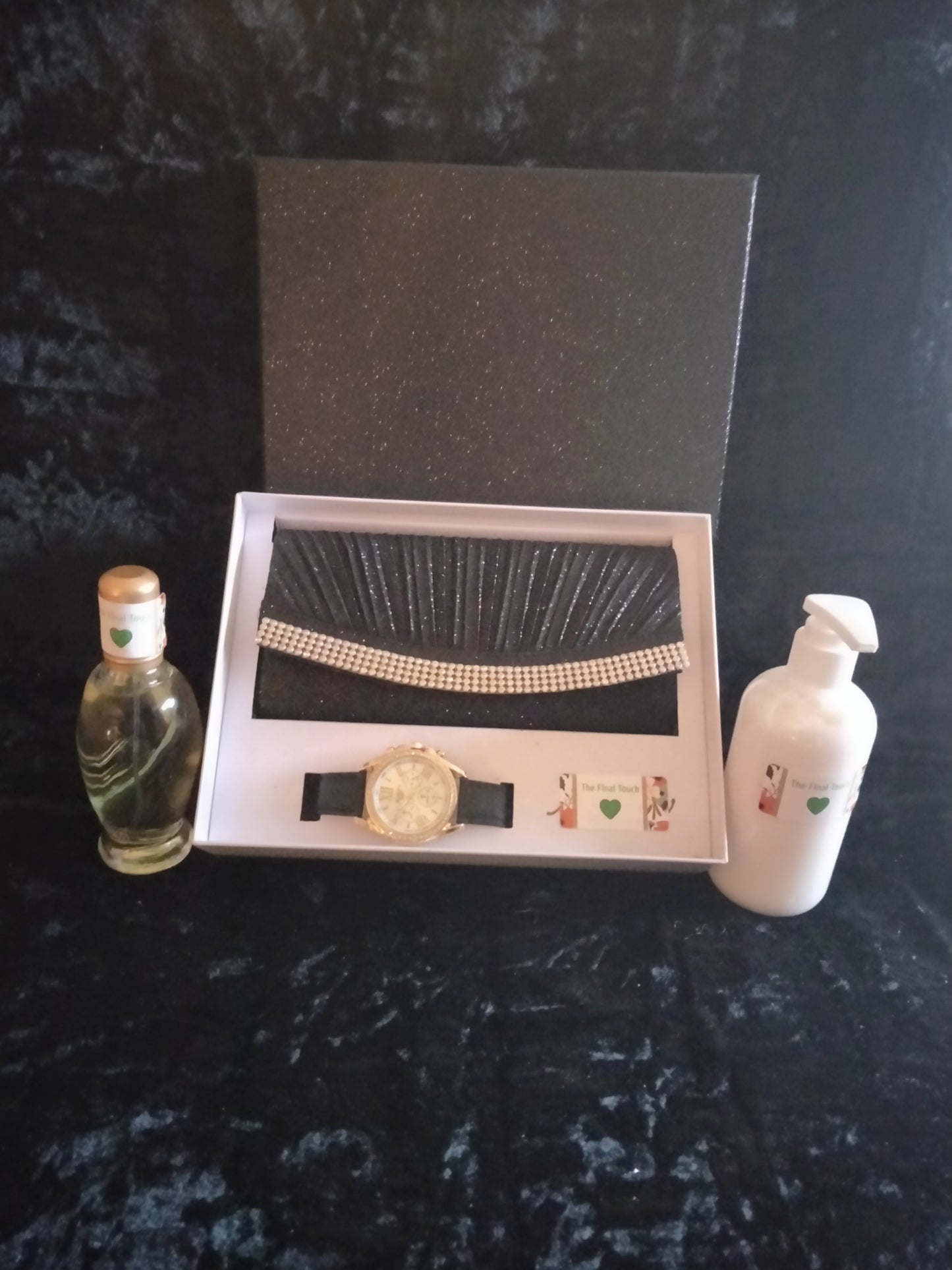 Purse matching watch perfume and skin care cream.