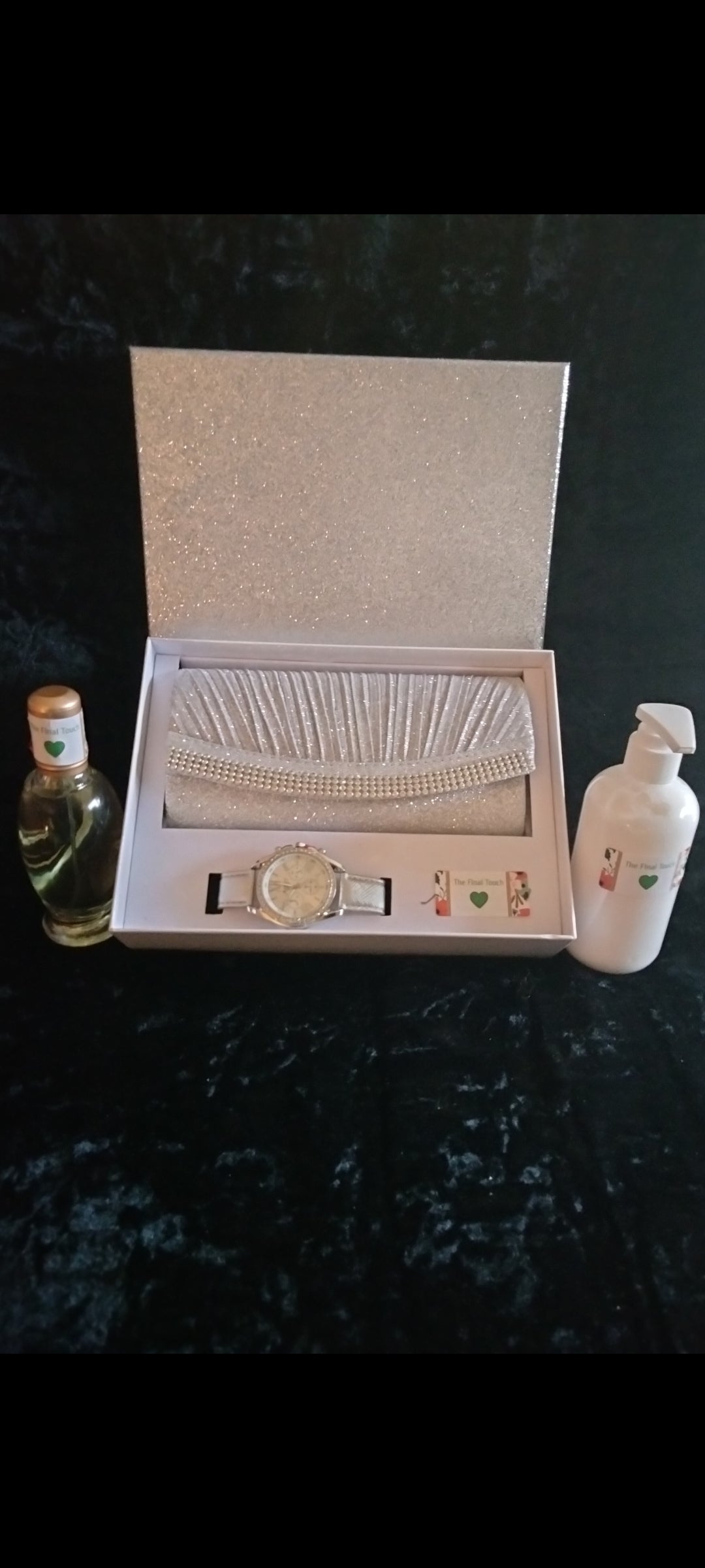 Purse matching watch perfume and skin care cream.